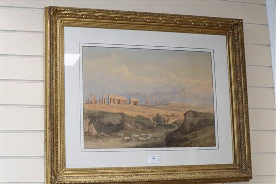 19th century English School, watercolour, Iberian oxon travelling in a landscape with classical ruins, 41 x 56cm